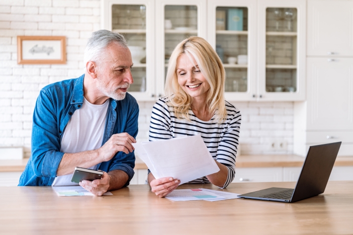 Couple reviewing year-end planning information. 