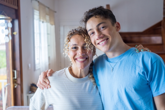 Mom and son smiling for picture