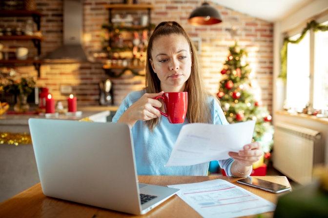 Women working through financial to-dos during the holidays