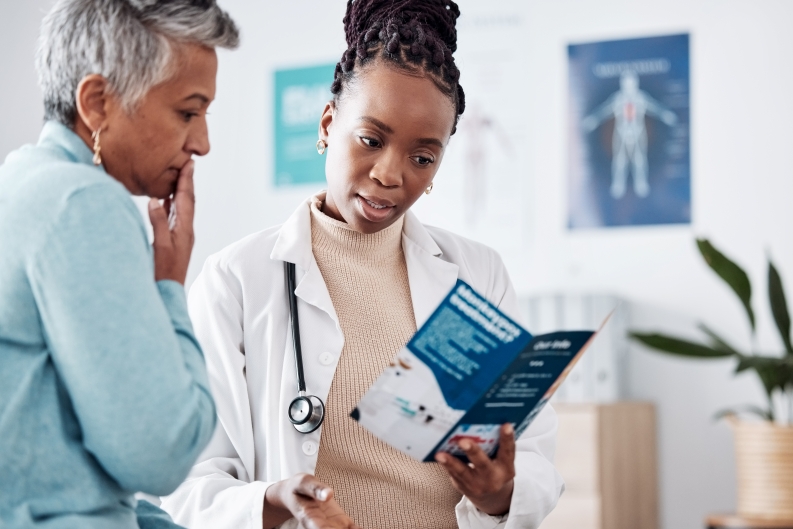 Doctor explaining health information to a patient