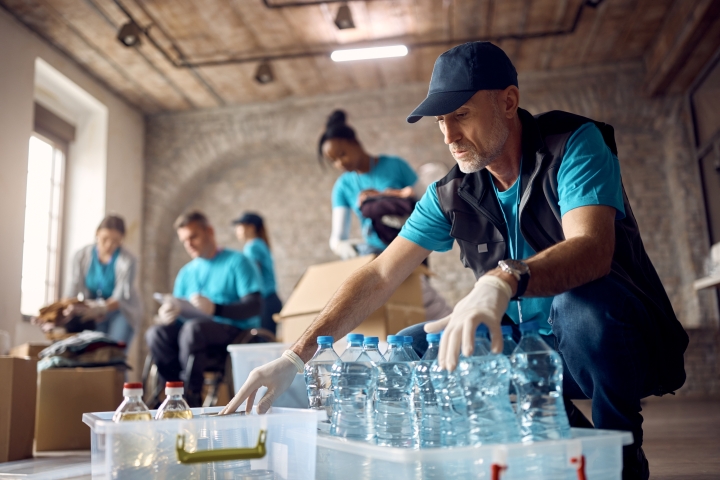 Group of people giving back by packing supplies