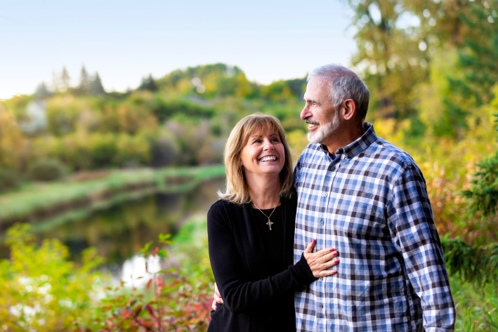 Retired couple walking together in a park
