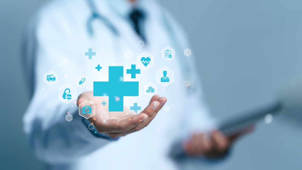 Doctor holding medical symbols